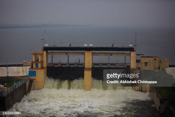Man walks on the open sluice gates of the Puzhal reservoir on November 09, 2021 in Chennai, India. As the world was discussing the effects of...