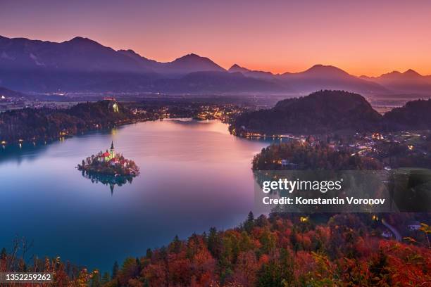 lake bled in slovenia at dusk. dawn, view from the hill of mala osojnica. sunrise, early morning. famous landmark. - lago di bled foto e immagini stock