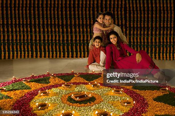 family sitting near rangoli - diwali family stock pictures, royalty-free photos & images
