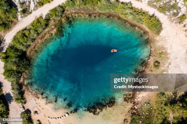 young woman floating on river spring - croatia food stock pictures, royalty-free photos & images