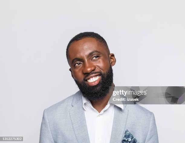 headshot of friendly mid adult businessman - black white faces stock pictures, royalty-free photos & images