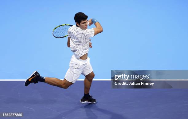 Carlos Alcaraz of Spain in his round robin match against Holger Vitus Nodskov Rune of Denmark during Day One of the Next Gen ATP Finals at Palalido...