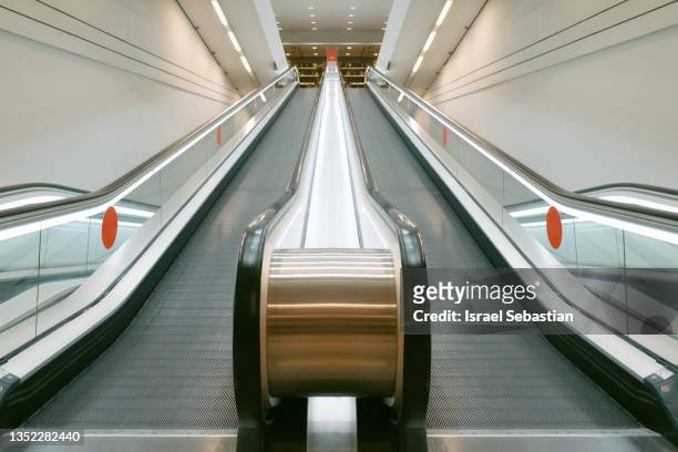 flat escalator in a shopping mall. - shopping centre escalator stock pictures, royalty-free photos & images