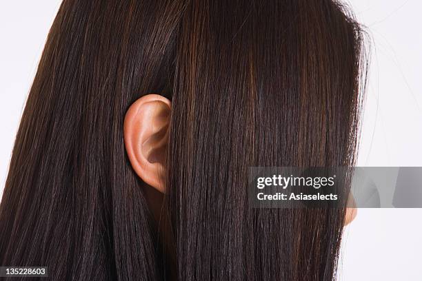 close-up of a businesswoman's ear - ear close up women stock-fotos und bilder