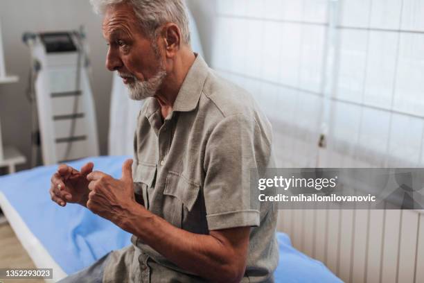 talking to his doctor - old cough stock pictures, royalty-free photos & images