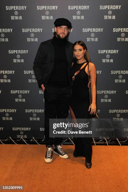 Lewis Burton and Lottie Tomlinson attend the launch of Superdry's new flagship store on Oxford Street with Brooklyn Beckham on November 09, 2021 in...