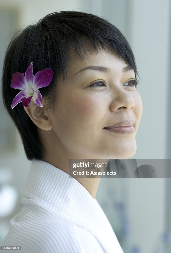 Side profile of a young woman smiling