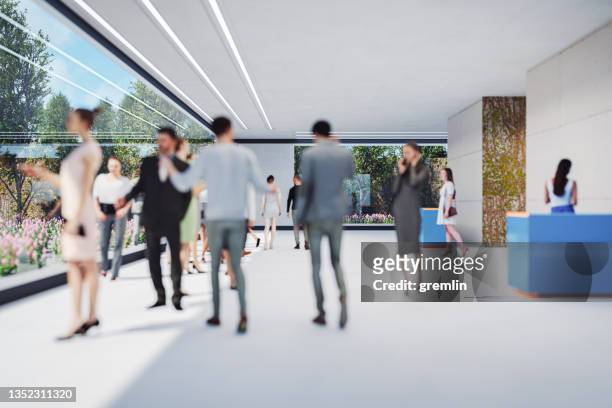 business people walking in the office lobby - incidental people stock pictures, royalty-free photos & images