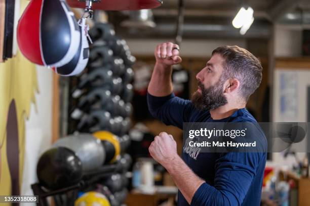 Mixed Martial Arts fighter and sports analyst Michael Chiesa hits a speed bag as Modelo, UFC and Rebuilding Together renovate Cappy's Boxing Gym on...