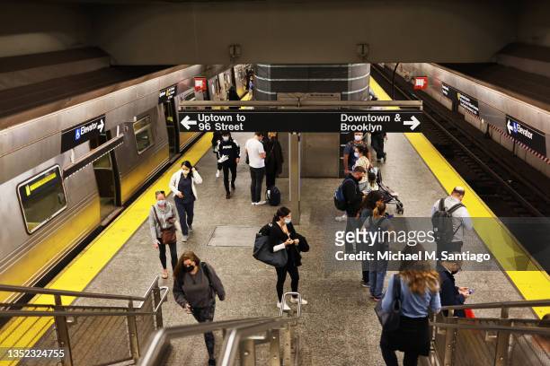 People walk along the train platform at the Second Avenue subway station on November 09, 2021 in New York City. On Friday Congress passed the...