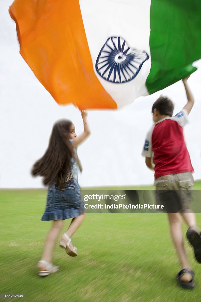 Children running with the Indian Flag