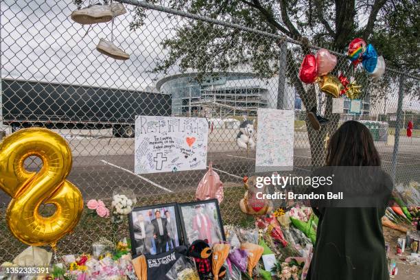 Woman views a memorial dedicated to those who died at the Astroworld festival outside of NRG Park on November 09, 2021 in Houston, Texas. Eight...