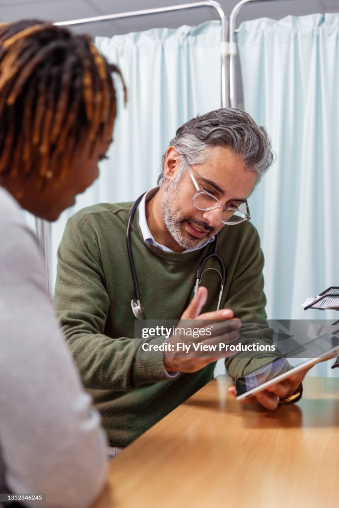 Testing Doctors Check Doctor Reviewing Medical Test Results With His Patient High-Res Stock ...