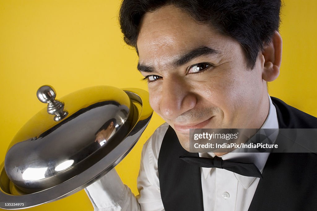 Butler holding a tray