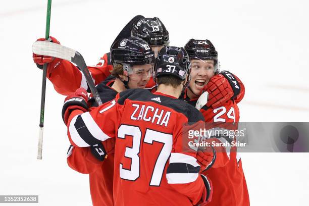 Pavel Zacha, Ty Smith, Alexander Holtz, and Nico Hischier of the New Jersey Devils celebrate a goal scored by Hischier during the first period...