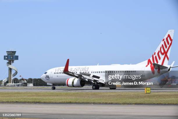 Virgin Australia aircraft lands at Sydney Airport on November 09, 2021 in Sydney, Australia.