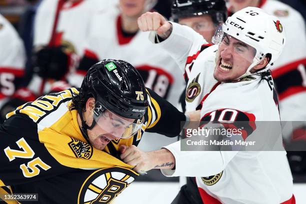 Alex Formenton of the Ottawa Senators fights with Connor Clifton of the Boston Bruins during the second period at TD Garden on November 09, 2021 in...