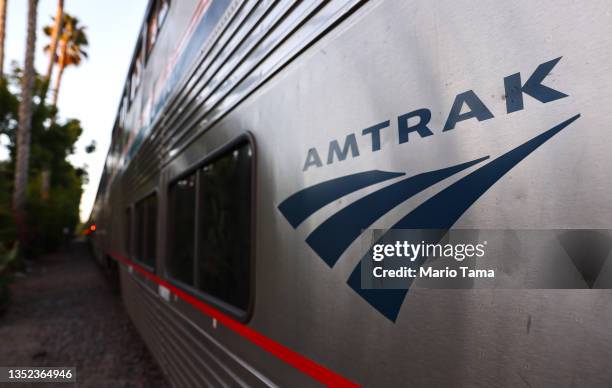 An Amtrak train is stopped at a station on November 9, 2021 in San Juan Capistrano, California. The newly passed $1.2 trillion Biden administration...