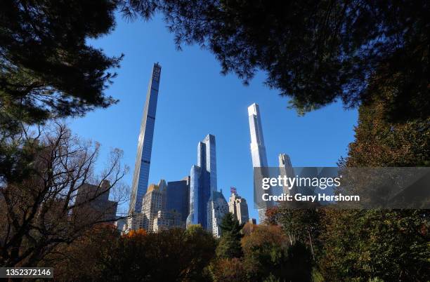 The Steinway Tower and Central Park Tower on Billionaires' Row rise above fall foliage in Central Park on November 9 in New York City.