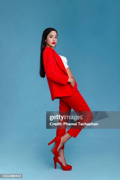 woman in suit - business woman in red suit jacket stock pictures, royalty-free photos & images