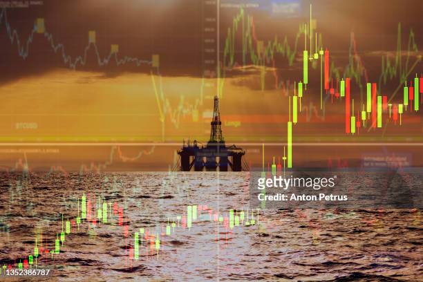 oil pump on the background of stock charts. world oil industry - 原油 ストックフォトと画像