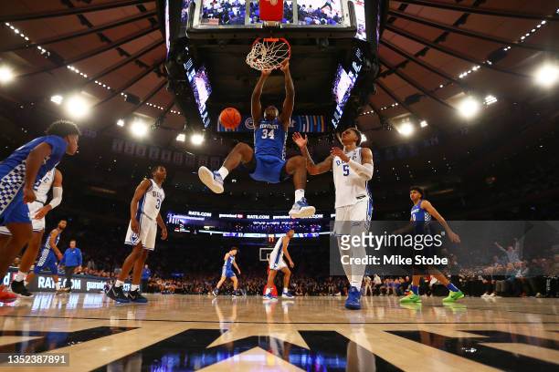 Oscar Tshiebwe of the Kentucky Wildcats dunks the ball against the Duke Blue Devils during the State Farm Champions Classic at Madison Square Garden...