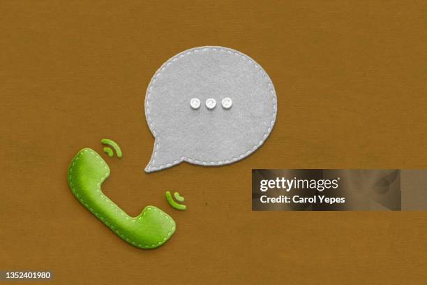 phone call icon in felt into a bubble speech - telephone receiver stock pictures, royalty-free photos & images