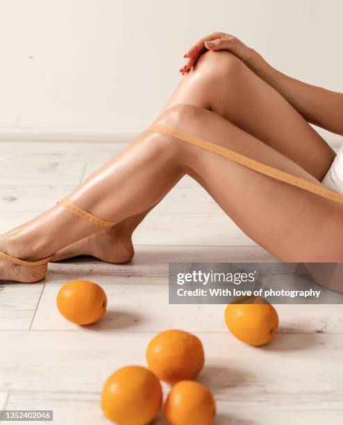 healthy lifestyle, young adult woman after massage beauty spa body care procedure self love beautiful hips and legs treatment - spagat stockfoto's en -beelden