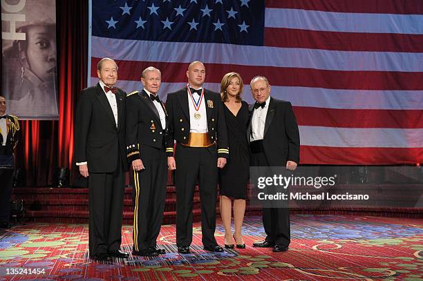 Oliver Mendell, Martin E. Dempsey, Jason Moritz, Chris Jansing and Myron Berman pose onstage at the 50th USO Armed Forces gala & Gold Medal dinner at...