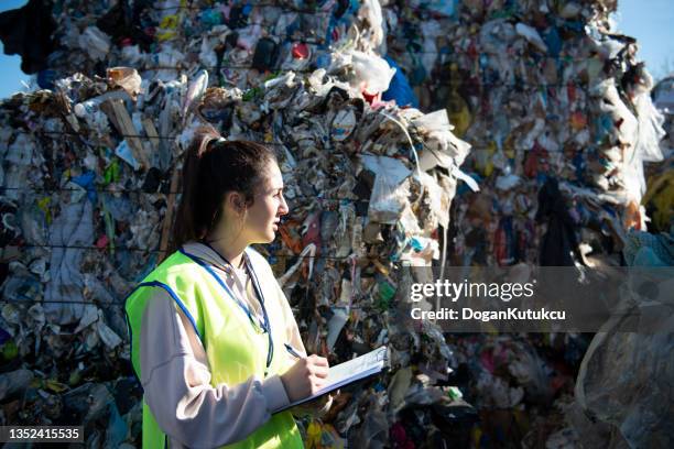 paper, plastic and metal waste piles prepared for recycling. recycling plant - landfill stock pictures, royalty-free photos & images