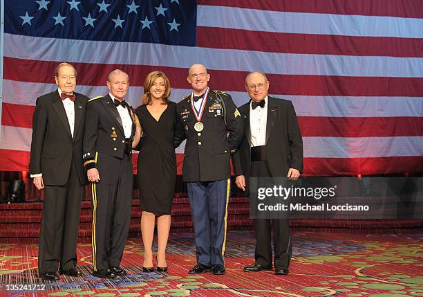 Oliver Mendell, Martin E. Dempsey, Chris Jansing, Soldier of the year Ty Carter and Myron Berman pose onstage at the 50th USO Armed Forces gala &...