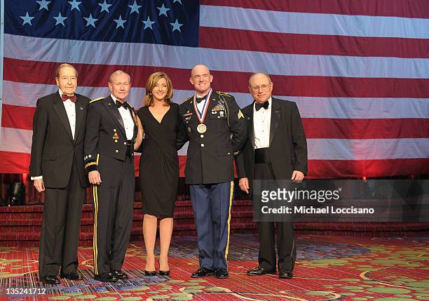 Oliver Mendell, Martin E. Dempsey, Chris Jansing, Soldier of the year Ty Carter and Myron Berman pose onstage at the 50th USO Armed Forces gala &...