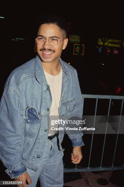 American actor Darryl M Bell, wearing a denim jacket over a white t-shirt with jeans, circa 1992.