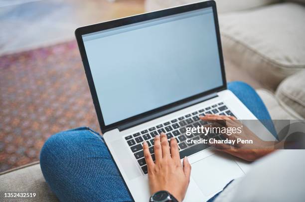 shot of an unrecognizable person using a laptop at home - computer screen close up stock pictures, royalty-free photos & images