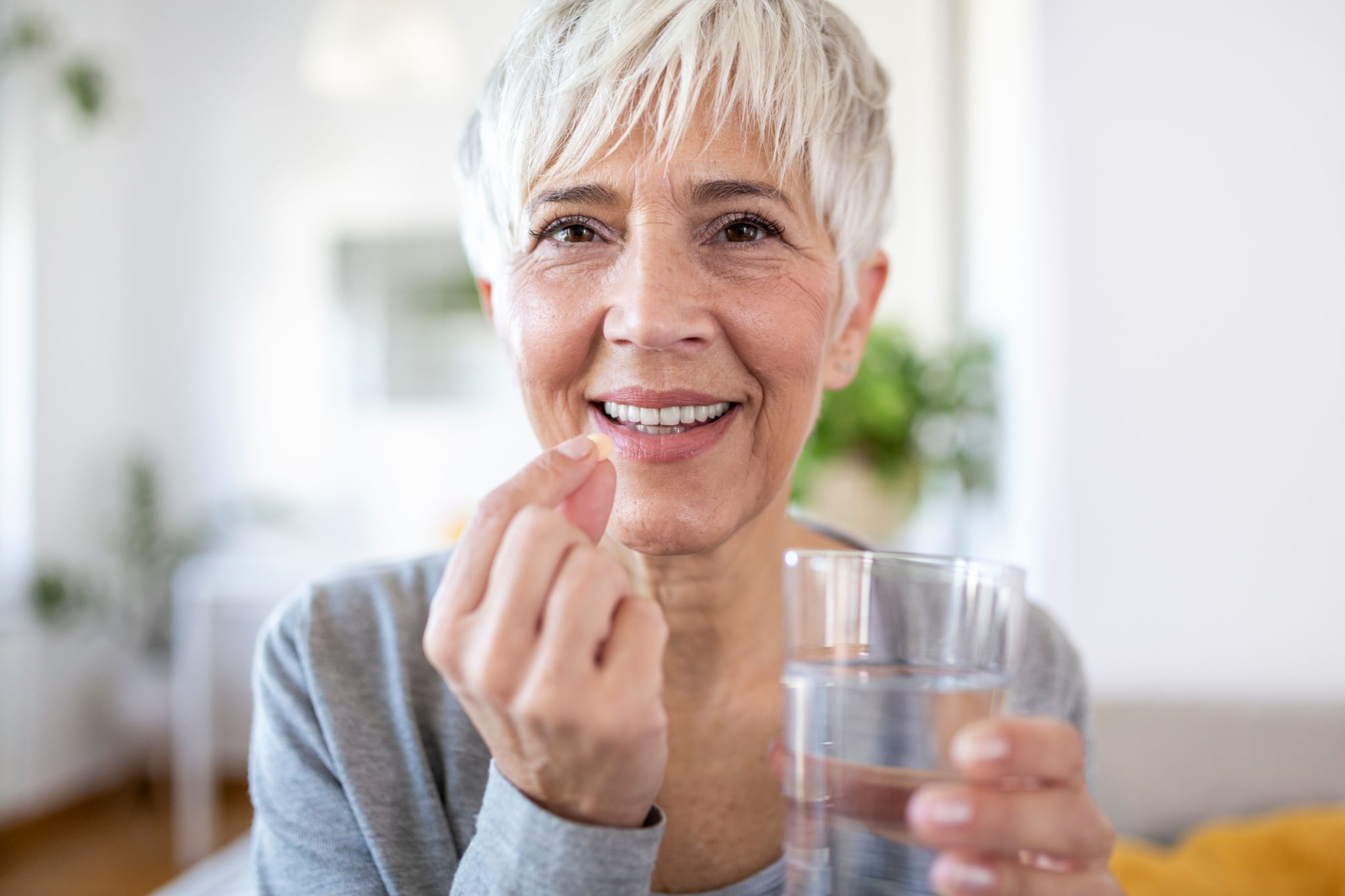 person taking supplement