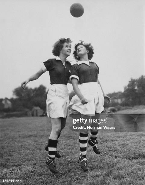 Team Captain Sally Eades and Chris Lihou, footballers for the Chelmsford Women's Football Club practice heading the ball during a training session on...