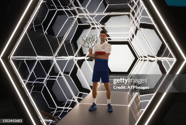 Novak Djokovic of Serbia poses with the trophy after winning the mens singles final against Daniil Medvedev of Russia on day seven of the Rolex Paris...
