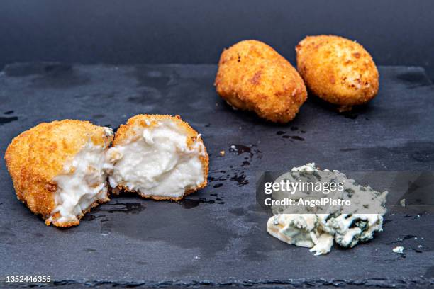 blue cheese croquettes on a slate dish - fried dough stock pictures, royalty-free photos & images