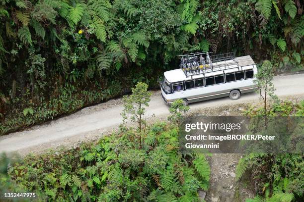 coach on the death road, camino de la muerte, la paz department, bolivia - coach bus stock-fotos und bilder