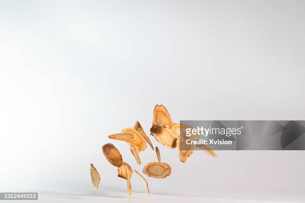american ginseng flying in mid air in white background - american ginseng imagens e fotografias de stock