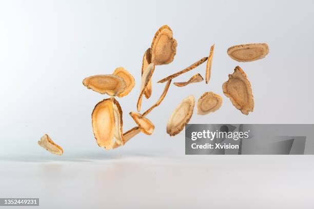 american ginseng flying in mid air in white background - american ginseng imagens e fotografias de stock