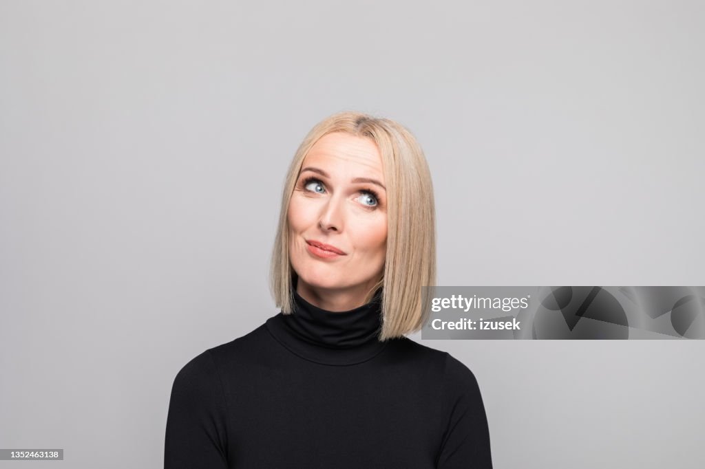Headshot of surprised mature businesswoman