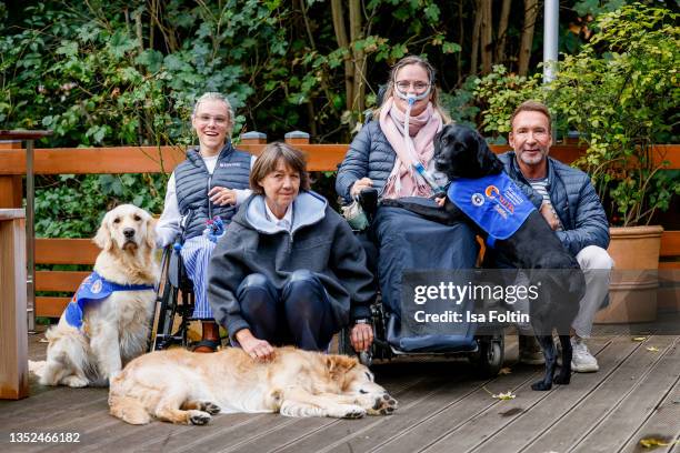 Frieda Krieger and her dog Ayden, VITA founder Tatjana Kreidler with her dog Finn, Nina Hoffmann with her dog Hazel and TV host Jochen Bendel during...
