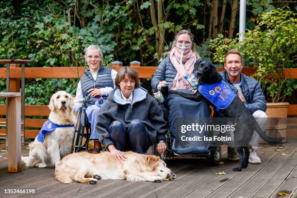 Frieda Krieger and her dog Ayden, VITA founder Tatjana Kreidler with her dog Finn, Nina Hoffmann with her dog Hazel and TV host Jochen Bendel during...