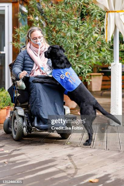 Nina Hoffmann with her dog Hazel during the Purina appeal campaign for VITA Assistenzhunde on September 28, 2021 in Huemmerich near Bonn, Germany.