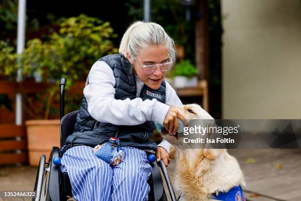 Frieda Krieger and her dog Ayden during the Purina appeal campaign for VITA Assistenzhunde on September 28, 2021 in Huemmerich near Bonn, Germany.