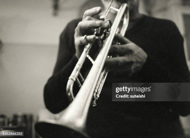 the hands of the trumpet player. - trumpet stock pictures, royalty-free photos & images