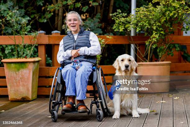 Frieda Krieger and her dog Ayden during the Purina appeal campaign for VITA Assistenzhunde on September 28, 2021 in Huemmerich near Bonn, Germany.