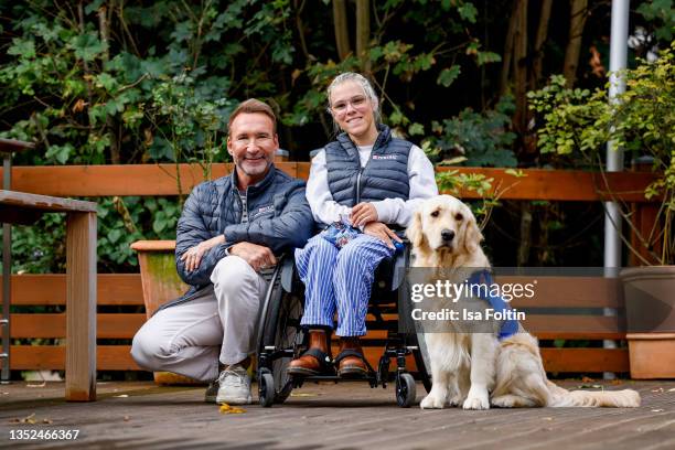 Host Jochen Bendel and Frieda Krieger and her dog Ayden during the Purina appeal campaign for VITA Assistenzhunde on September 28, 2021 in Huemmerich...