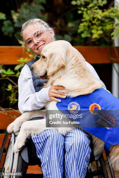 Frieda Krieger and her dog Ayden during the Purina appeal campaign for VITA Assistenzhunde on September 28, 2021 in Huemmerich near Bonn, Germany.